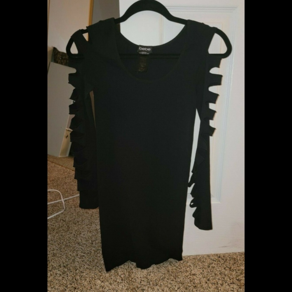 Bebe Dress Never Worn! Sleeves have unique Design.